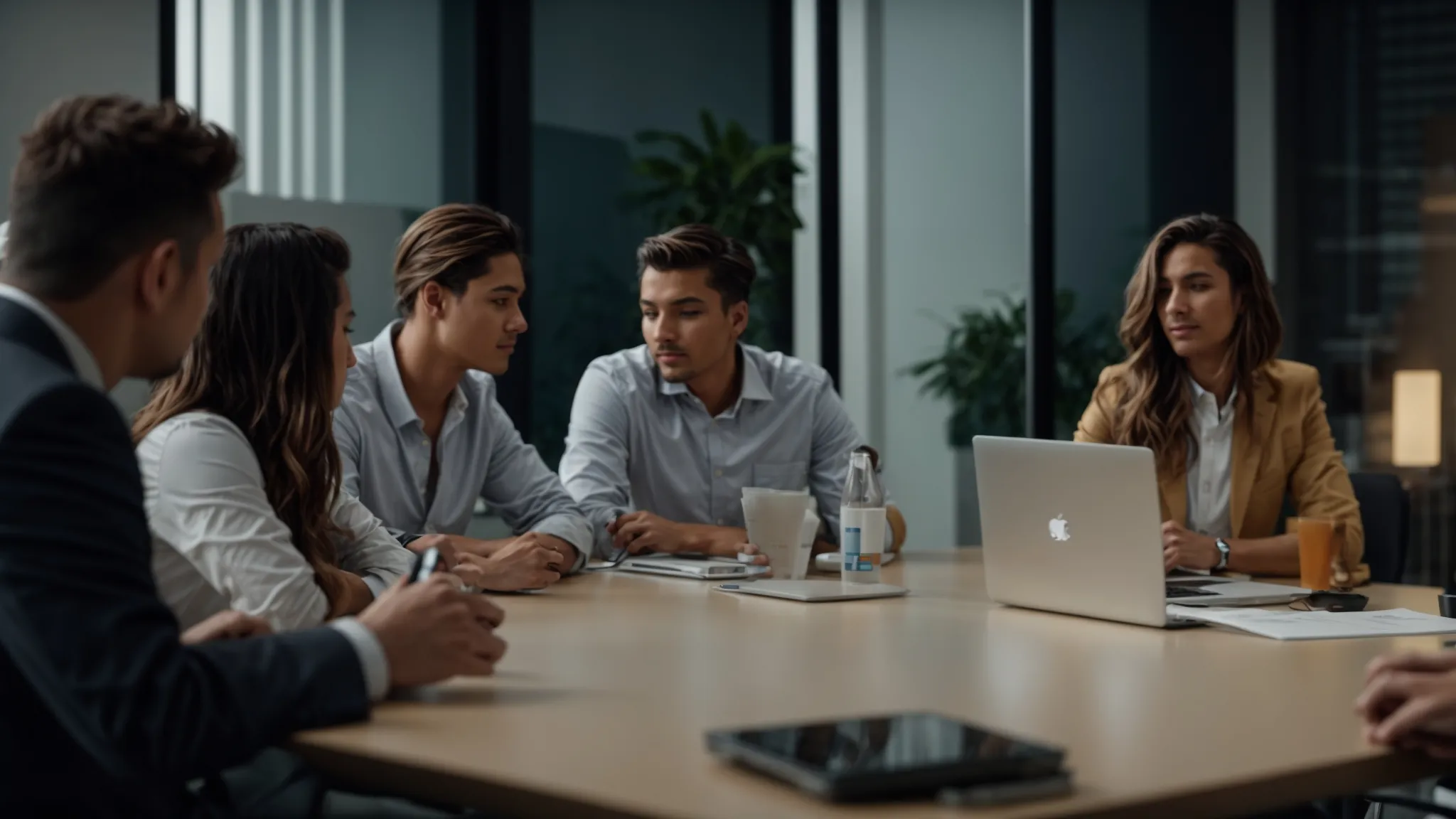 a group of people brainstorming and discussing brand marketing strategies in a modern office conference room.